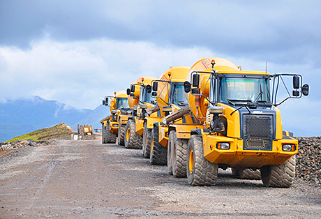 The articulated dump trucks line up ready for work in an application that brings a new dimension to wind farm development.