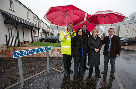 Steve Bentley, Falkirk Council, tenant Laura Ross, Peter Shepherd from Mactaggart & Mickel Group, Margaret Burgess MSP and Neil Rutherford from Scottish Futures Trust.