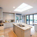 View of marble topped worktop units in modern kitchen at home
