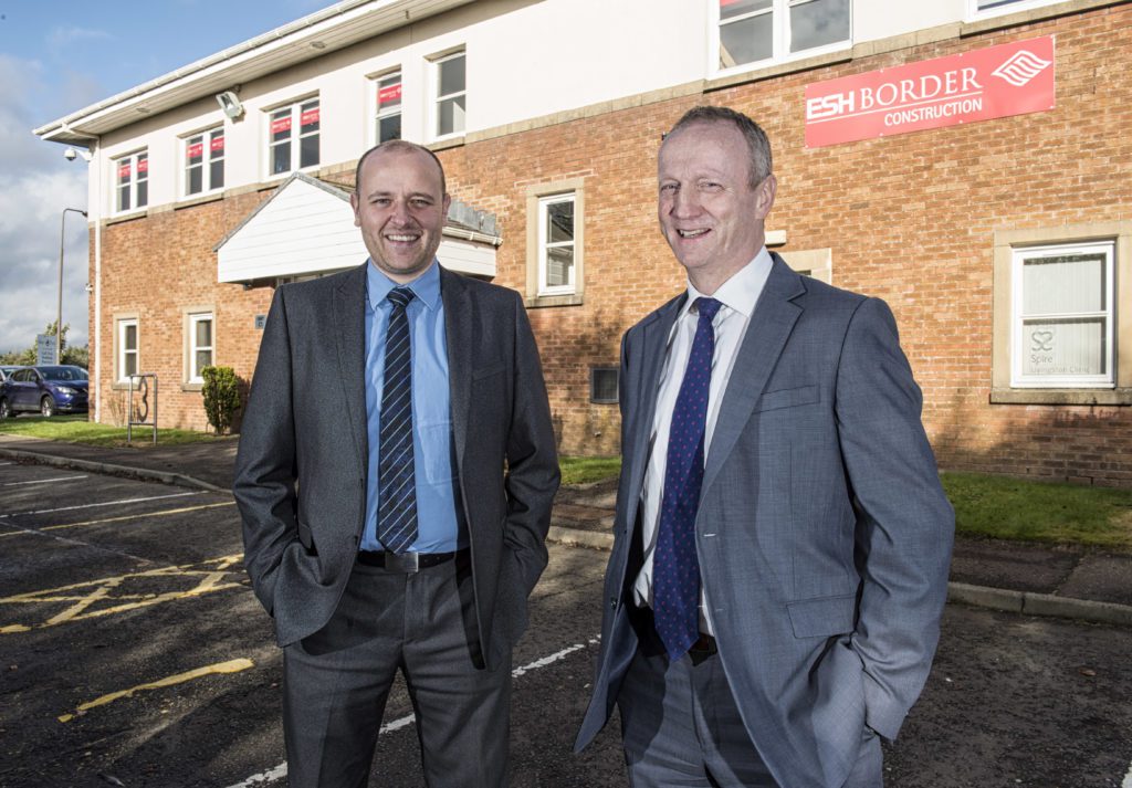 Picture by Christian Cooksey/CookseyPix.com on behalf of Ash Border Construction and Beattie Communications. Regional managing director, Simon Phillips (right) alongside business development manager, Euan McDermott at Esh Border Construction's offices in Livingston. All rights reserved. For full terms and conditions see www.cookseypix.com