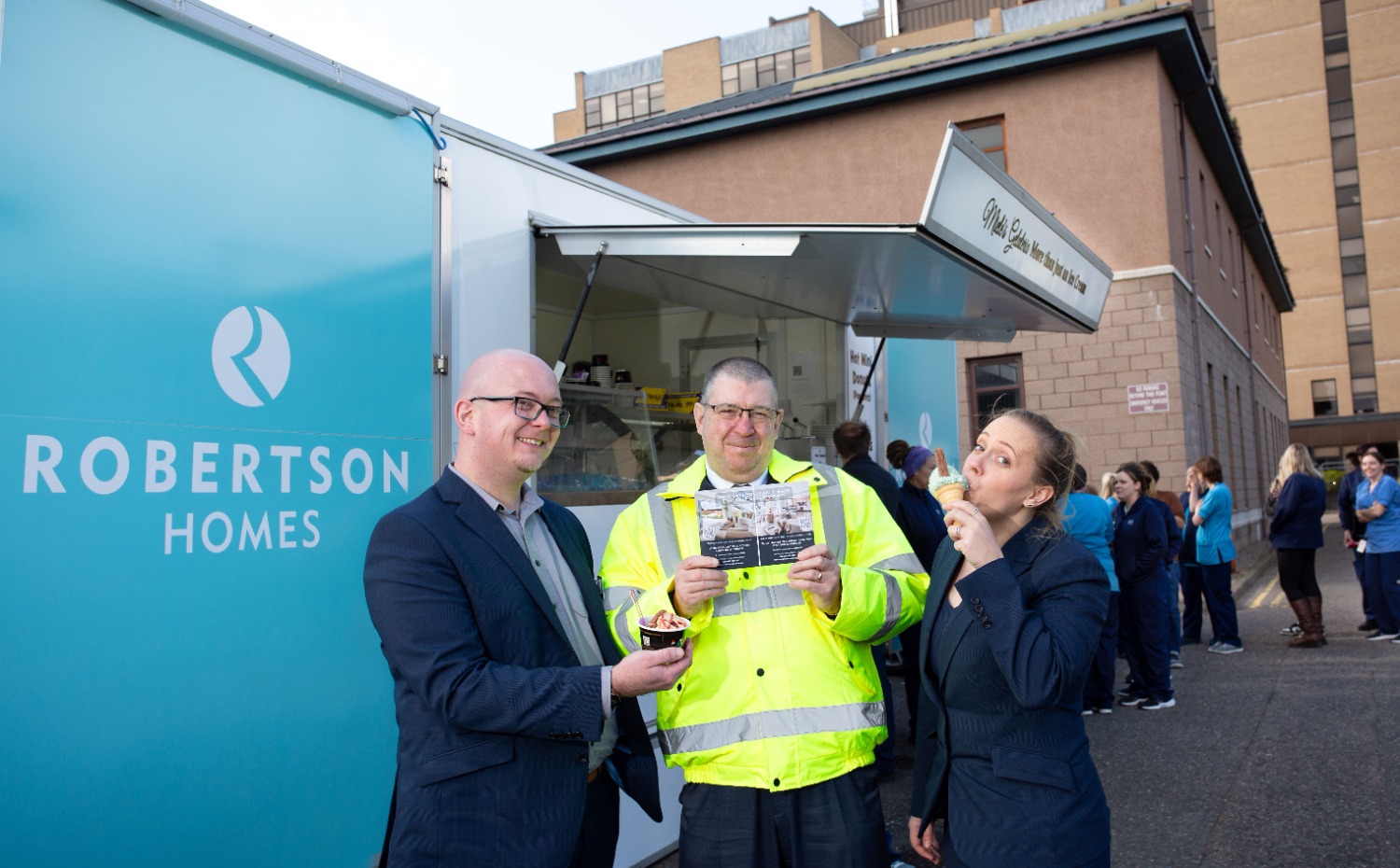 Tam McFadyen (centre) from Raigmore Hospital enjoys an ice cream with Roberton Homes sales executives Daniel Millington and Sarah Proctor