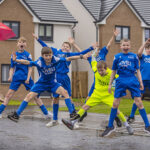 Lovell football kit donation in South Queensferry