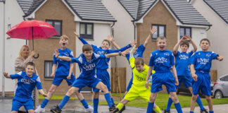 Lovell football kit donation in South Queensferry