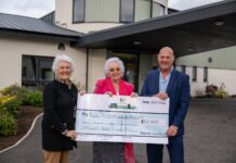 Sandy Macleod presenting a £10,000 cheque to Elsie Normington and Elizabeth Mackintosh