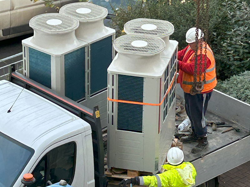 Heat pump ready for installation on roof of Warmworks office building