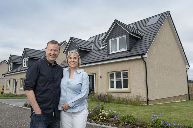 Barbara and partner John with their David Wilson Homes property