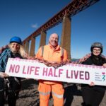 Forth Bridge Abseil charity event returns for 2025 Event team stand in front of Forth Bridge