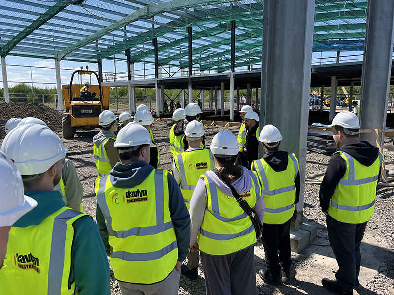 College students visiting construction project