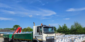 Lorry transporting construction products