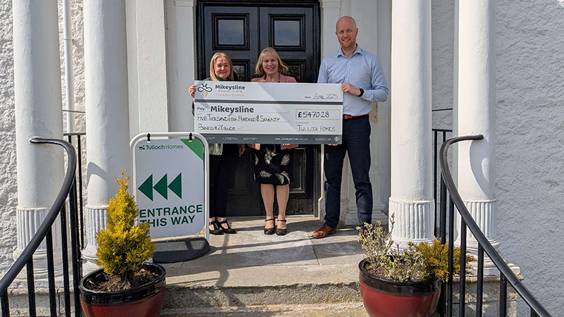 Charity cheque being handed over