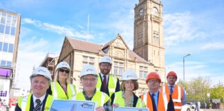 Project team outside of Motherwell Town Hall alongside revamp plans
