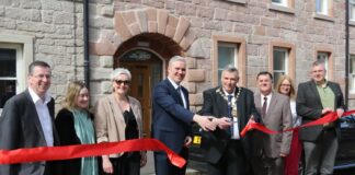 Port Glasgow Community Hub official opening. From left, Councillors Jim Clocherty, Natasha McGuire, Francesca Brennan, Investment Minister Tom Arthur, Provost Drew McKenzie, Councillor Stephen McCabe, Corporate Director of Education and Communities Ruth Binks, and Councillor Chris Curley outside the refurbished building, formerly known as the King George VI building.