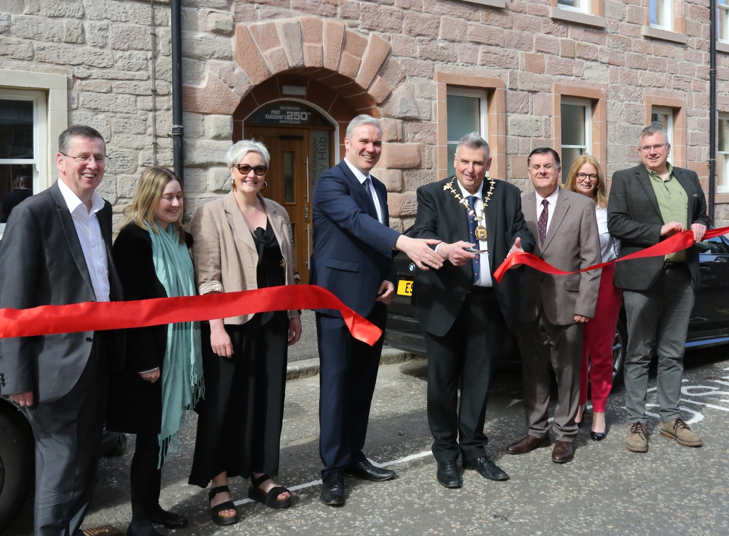 Port Glasgow Community Hub official opening. From left, Councillors Jim Clocherty, Natasha McGuire, Francesca Brennan, Investment Minister Tom Arthur, Provost Drew McKenzie, Councillor Stephen McCabe, Corporate Director of Education and Communities Ruth Binks, and Councillor Chris Curley outside the refurbished building, formerly known as the King George VI building.