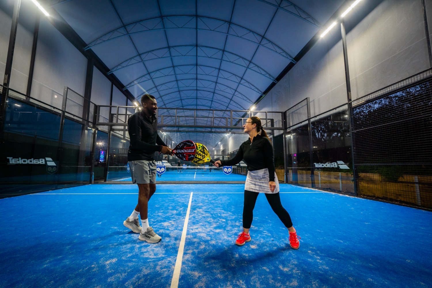 Two padel plays on a court