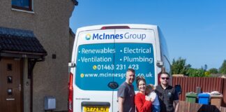 Image of Sophie's family alongside McInness van