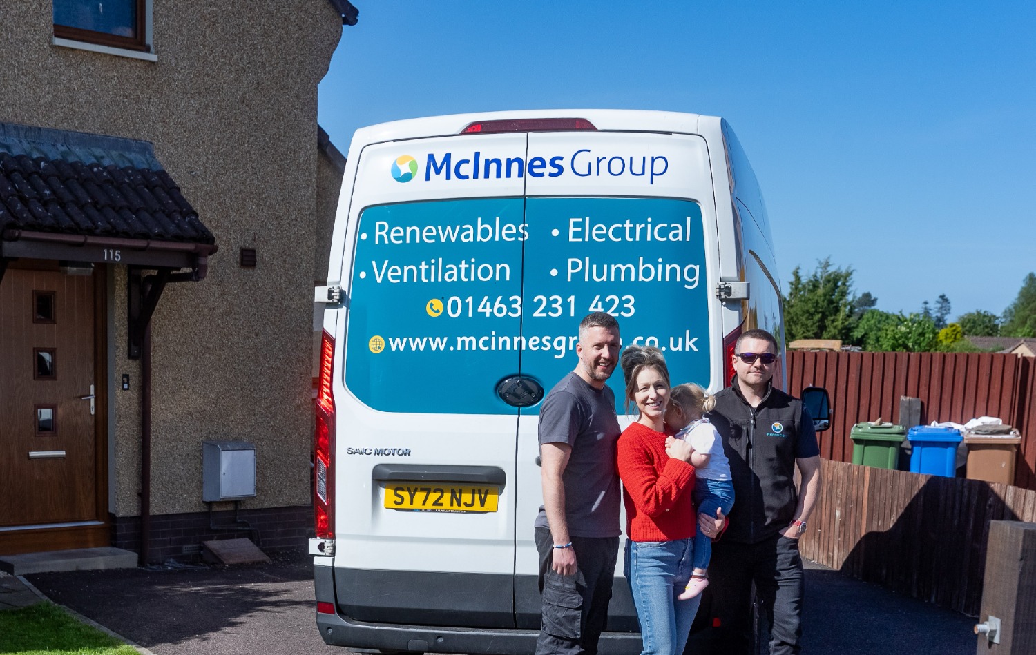 Image of Sophie's family alongside McInness van
