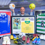 John Horne with collection of sports memmorabilia