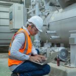 The massive challenge for construction as PFI agreements come to an end Worker using a laptop