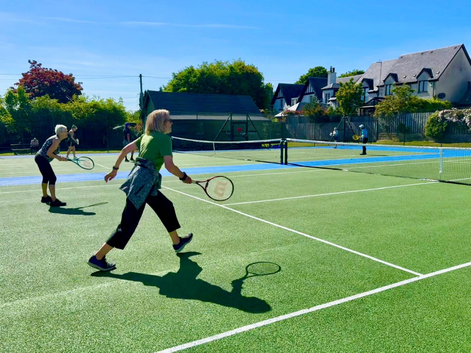 Players enjoying the new courts at Juniper Green
