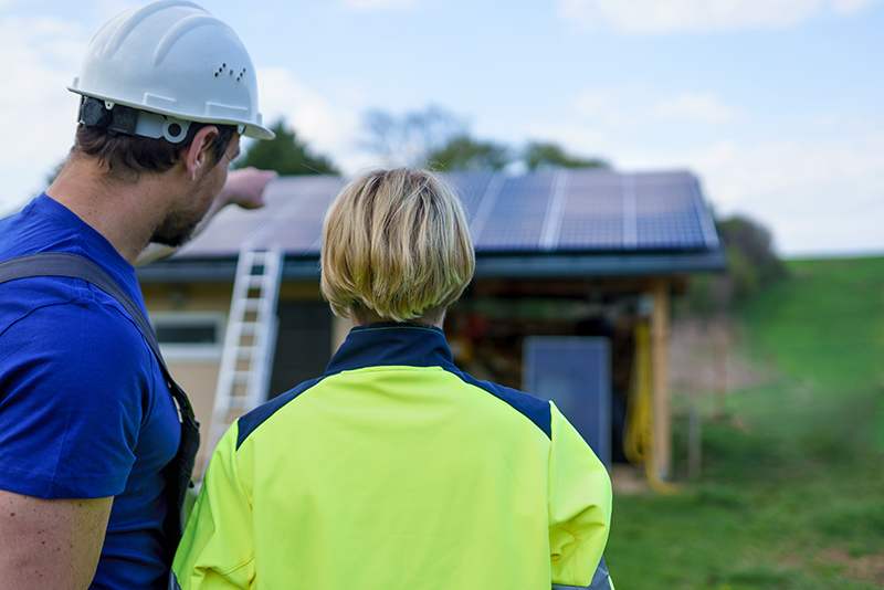 Male and female solar installers