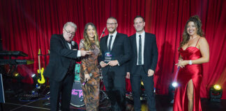 Architecture practice on stage accepting award