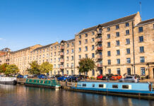 EHA welcomes energy efficiency proposals but calls for more protections for tenants Narrowboats and cars outside buildings in Glasgow