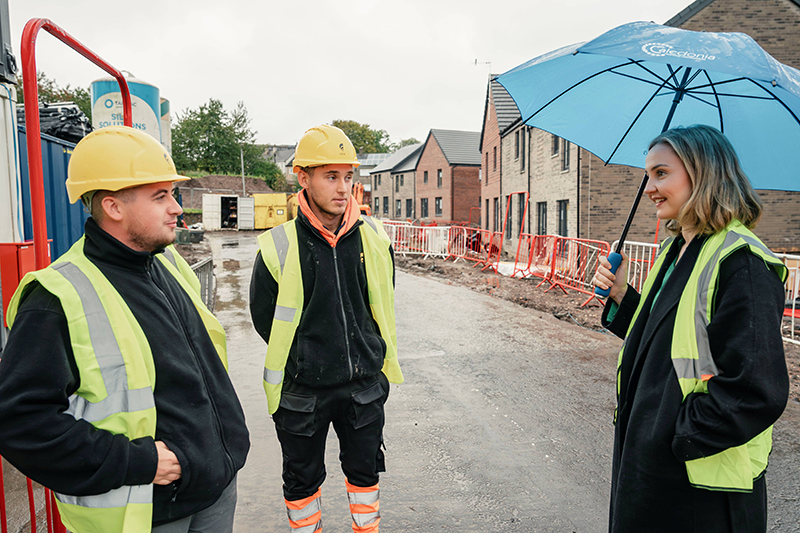 Apprentices Kevin Docherty and Reiss Fox with the Cabinet Secretary