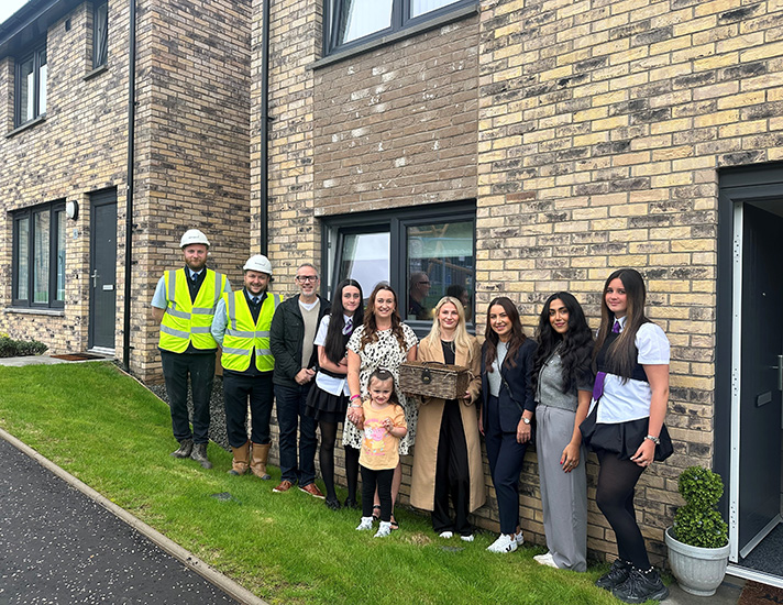 Group photo at new housing development in Glasgow