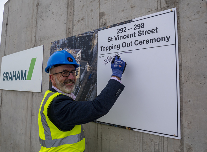 Commemorative plaque being signed in Glasgow