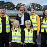 Housebuilder donates hi-vis vests to help keep children safe Children in hi-vis vests to promote safety campaign