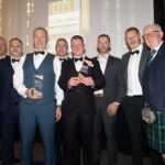 Double success for Orkney firms at national construction awards Construction award winners on stage
