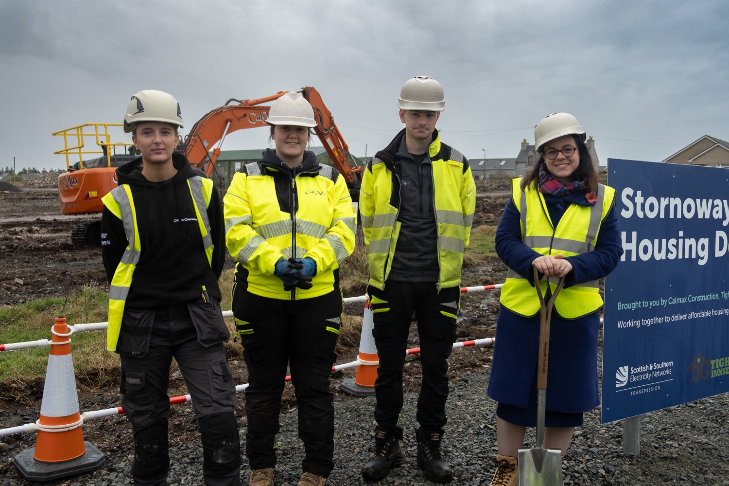 Kate Forbes with local apprentices working at the Stornoway Airport housing development