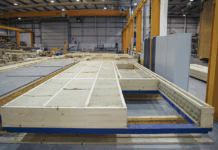 Panels with sustainable insulation being manufactured