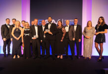 Robertson honoured for partnership working at national awards Robertson Facilities Management team collecting award