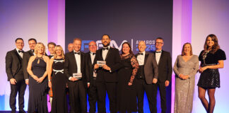 Robertson Facilities Management team collecting award