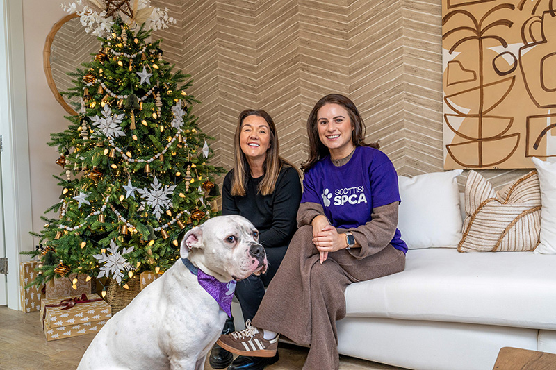 Sharon Spinelli (left) of Robertson Homes with Megan Stobo from Scottish SPCA and Sharon's rescue dog Romeo