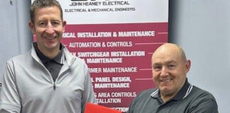 JHE Contracts Director Derek Menzies (left) presenting the award to Charlie Smillie