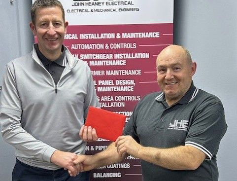 JHE Contracts Director Derek Menzies (left) presenting the award to Charlie Smillie