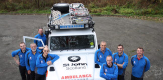 Ambulance with image marking charity donation
