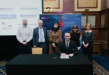 Scottish Water makes landmark commitment to low carbon concrete Scottish Water's Chris Arnold signing the AMC