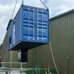 Turbine kiosk being manoeuvred into position at Carron Valley