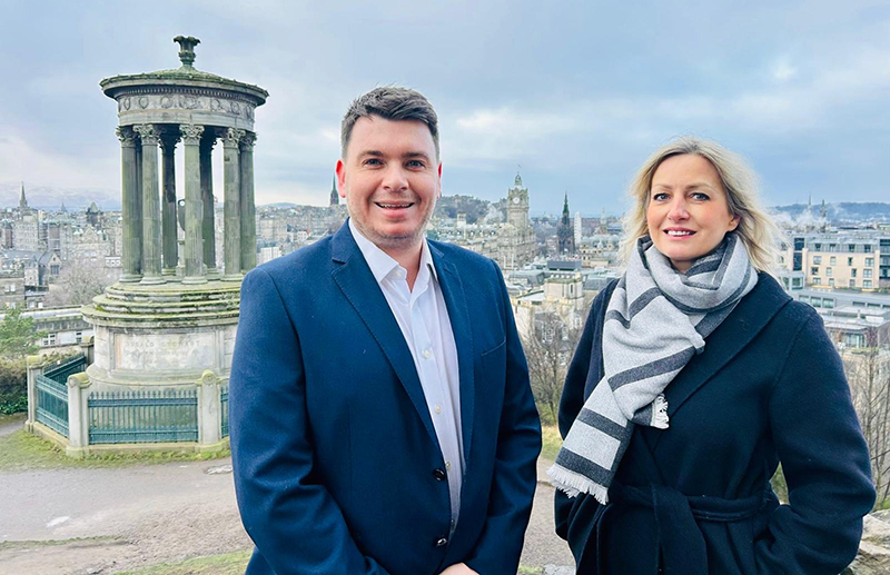 Associate directors standing outside in Edinburgh