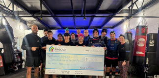 Charity challenge participants in boxing gym