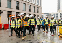 Visitors tour a construction site