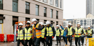 Visitors tour a construction site