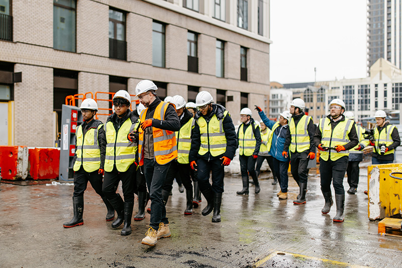 Visitors tour a construction site