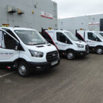 Fleet of vans parked up in a row