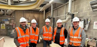 Visitors on tour of a stonemason carving centre