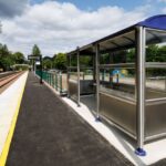 View of platform with seating area and tracks