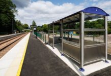 View of platform with seating area and tracks